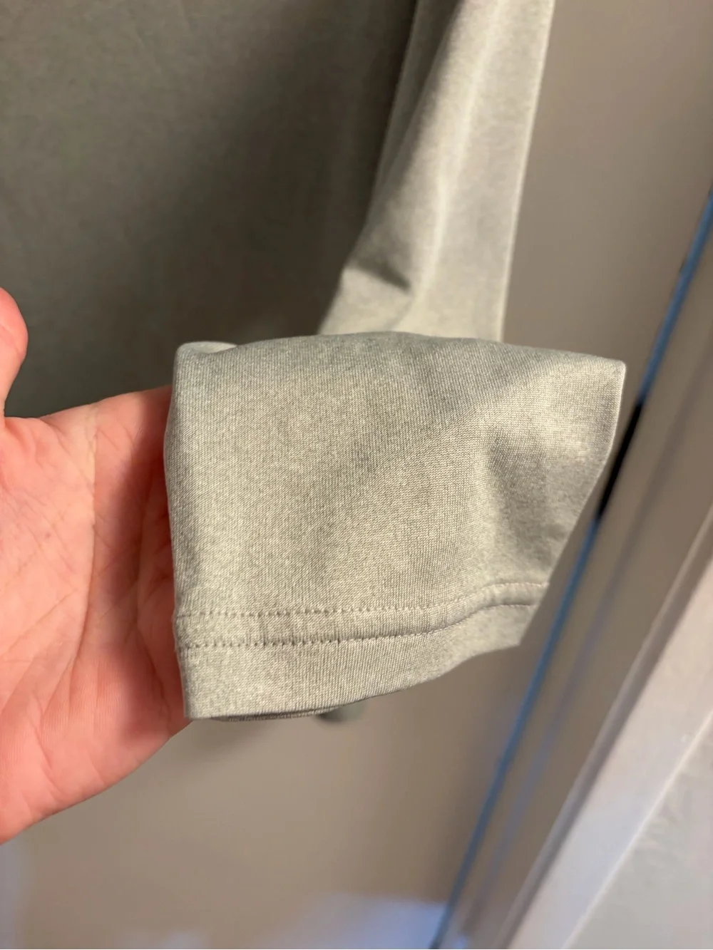 Nike Light Gray Long Sleeve Athletic Top with Black Swoosh